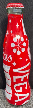 P06035-1 € 4,00 coca cola flesje glas plastic omwikkeld Las Vegas ( leeg)
